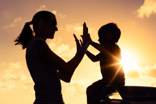 Image of happy mother and child after resolving child arrangements Clwyd